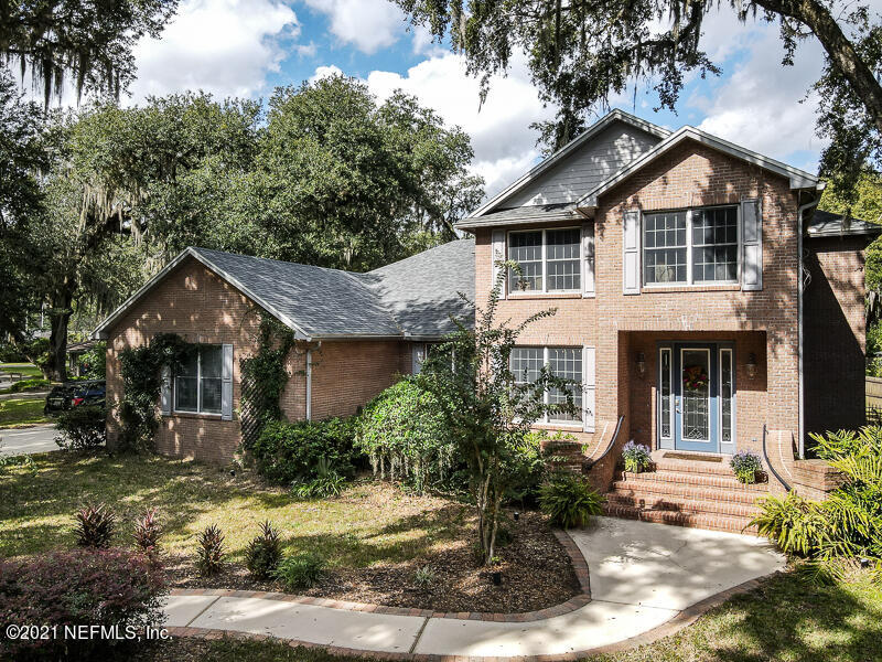 2710 Holly Point Road East Orange Park, FL 32073 - Photo 57 of 64 a front view of a house with a yard