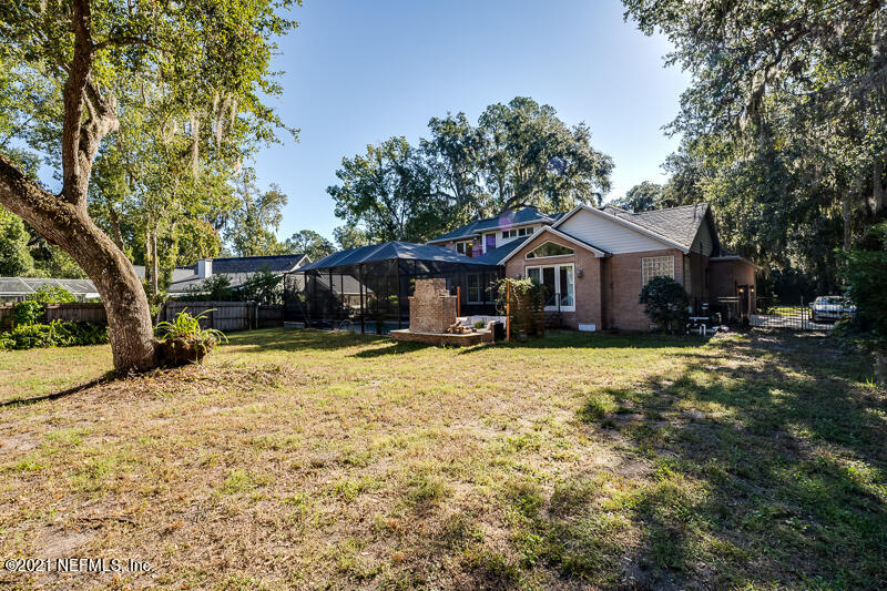 2710 Holly Point Road East Orange Park, FL 32073 - Photo 59 of 64 a front view of a house with a yard covered with snow