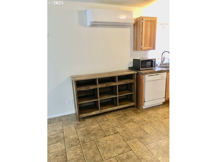 1475 Green Acres Road, Unit 76 Eugene, OR 97408 - Photo 9 of 23 a view of cabinets with wooden floor and cabinet