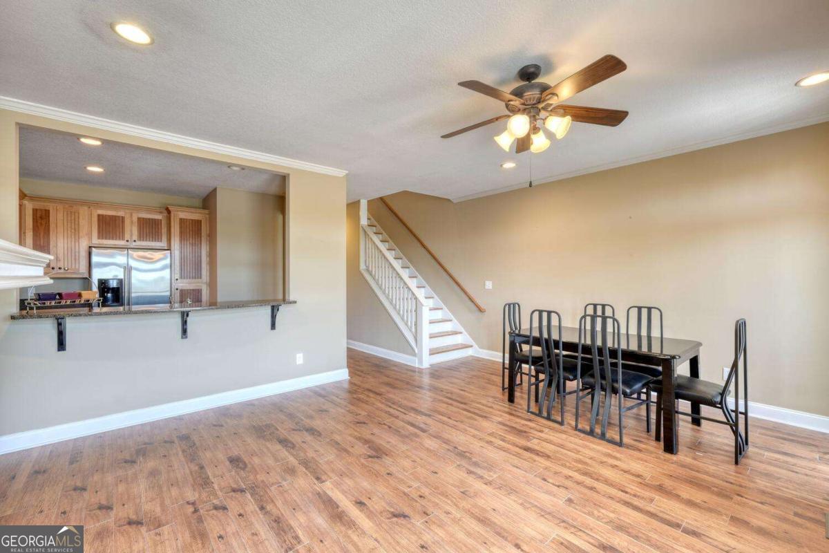 1401 Lakeside Road, Unit 502 Hiawassee, GA 30546 - Photo 12 of 46 a view of a dining room with furniture and wooden floor