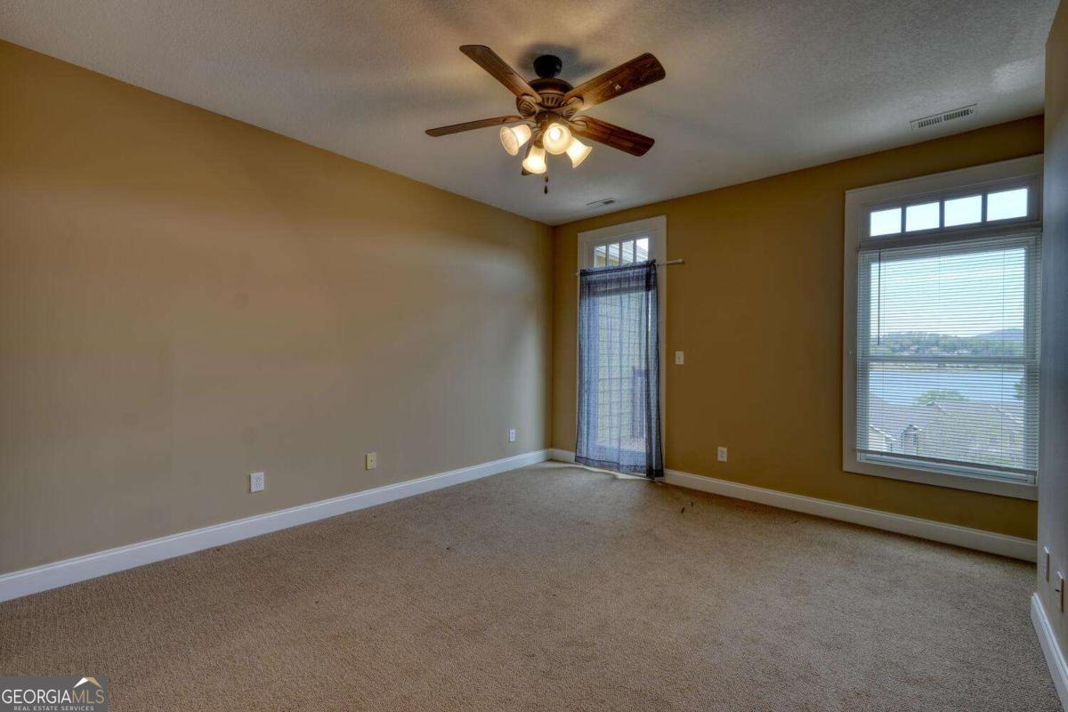1401 Lakeside Road, Unit 502 Hiawassee, GA 30546 - Photo 18 of 46 a view of an empty room with a window