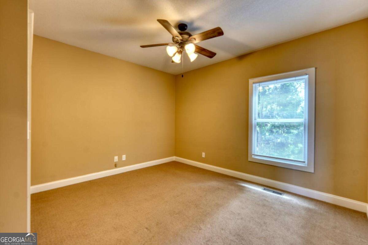 1401 Lakeside Road, Unit 502 Hiawassee, GA 30546 - Photo 22 of 46 a view of an empty room with a window