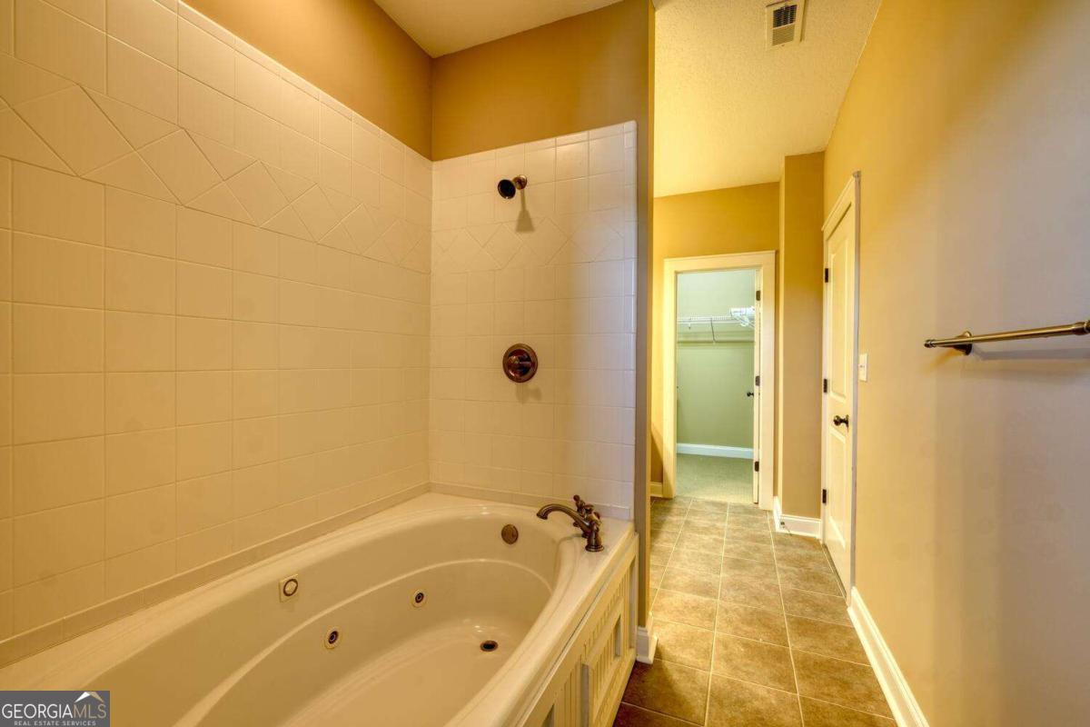 1401 Lakeside Road, Unit 502 Hiawassee, GA 30546 - Photo 28 of 46 a bathroom with a tub shower and sink