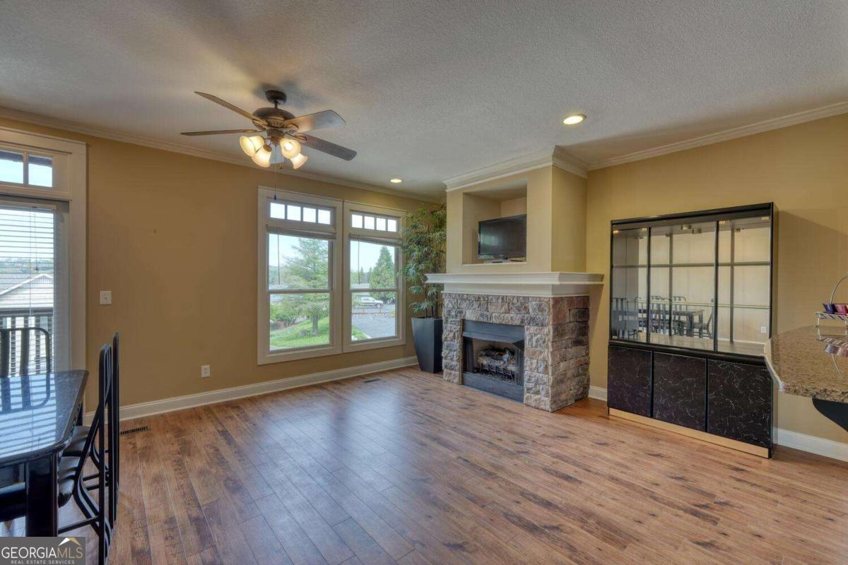 1401 Lakeside Road, Unit 502 Hiawassee, GA 30546 - Photo 3 of 46 a view of an empty room with a fireplace and a window
