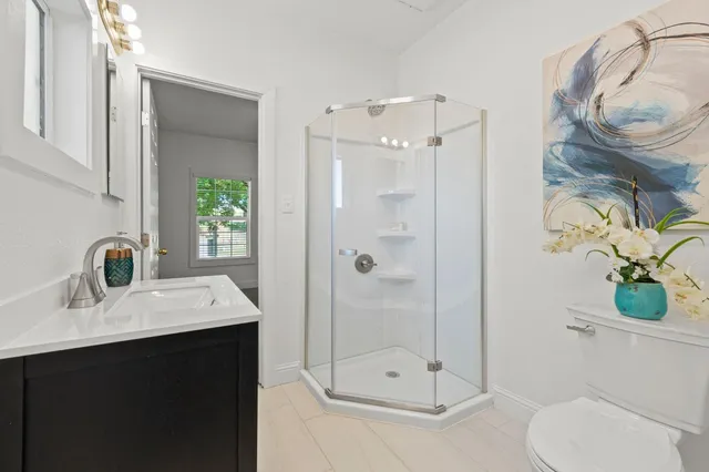 a bedroom with a bed and a lamp