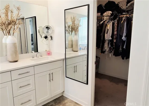 a bathroom with a double vanity sink and mirror