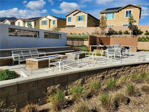 a terrace of a house with barbeque oven