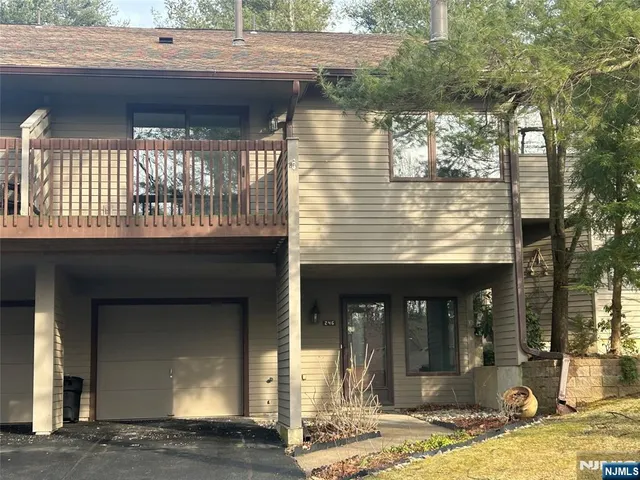 an empty room with wooden floor and closet
