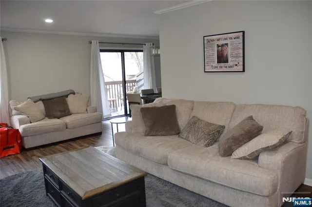 a kitchen with a refrigerator sink and cabinets