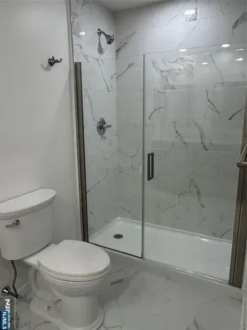 a bathroom with a double vanity sink and mirror