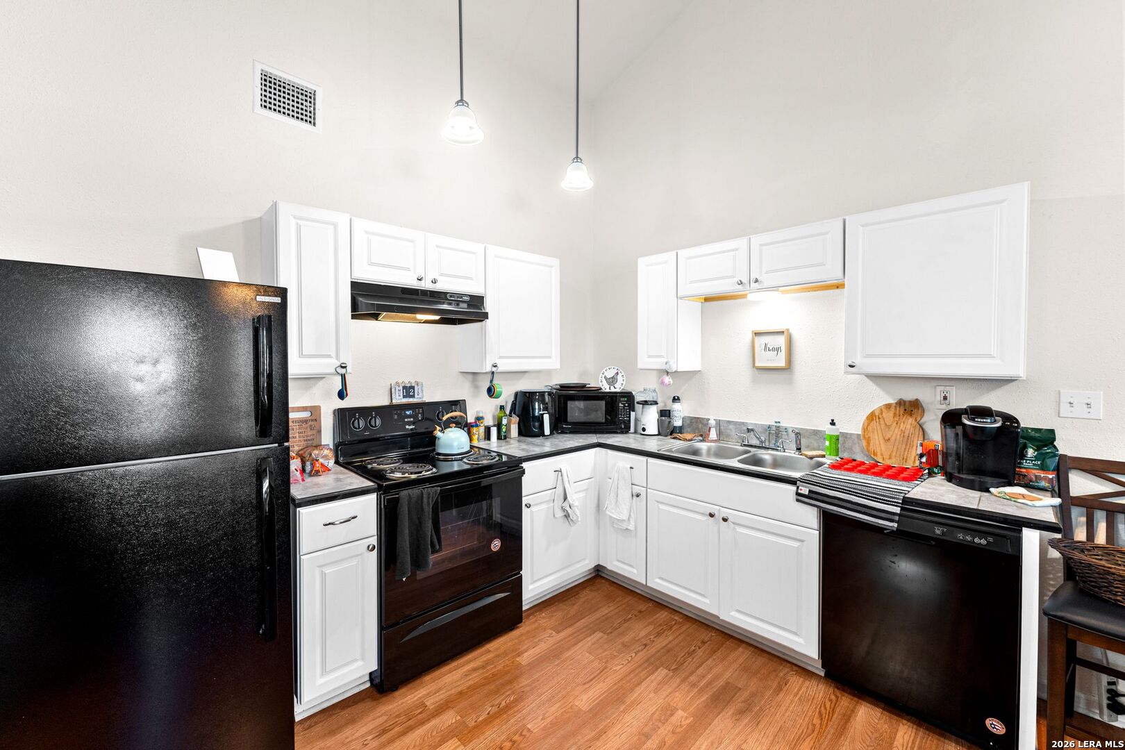 289 Chaparral Drive Bandera, TX 78003 - Photo 11 of 27 a kitchen with stainless steel appliances granite countertop a sink a stove and a refrigerator