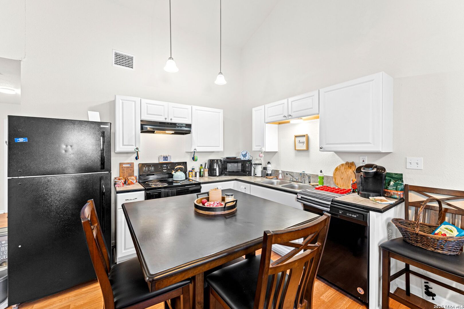 289 Chaparral Drive Bandera, TX 78003 - Photo 14 of 27 a kitchen with a dining table chairs stove and kitchen view