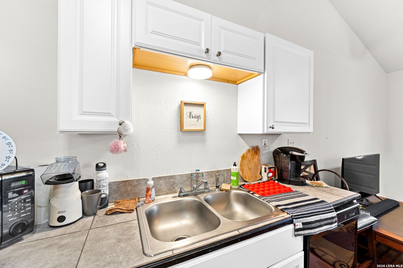 289 Chaparral Drive Bandera, TX 78003 - Photo 16 of 27 a kitchen with a sink cabinets and appliances