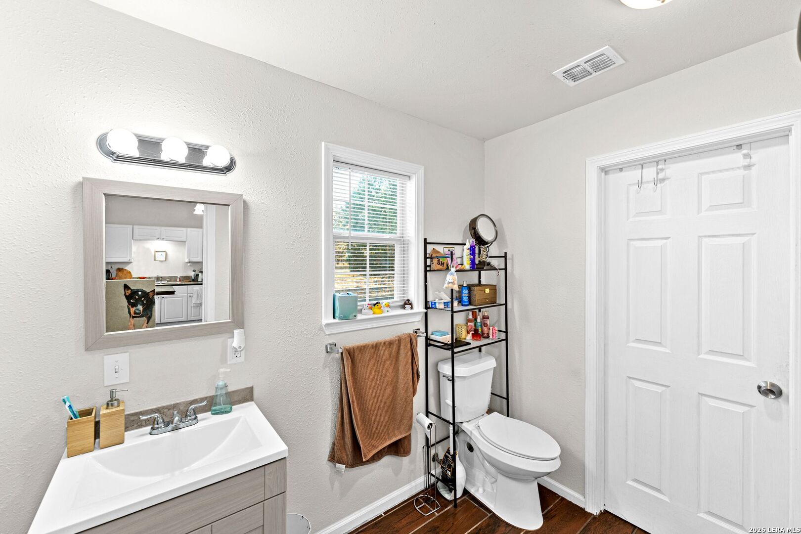 289 Chaparral Drive Bandera, TX 78003 - Photo 17 of 27 a bathroom with a sink toilet and a mirror