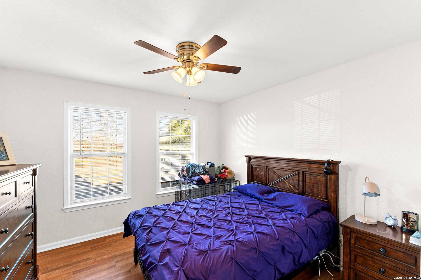 289 Chaparral Drive Bandera, TX 78003 - Photo 19 of 27 a bedroom with a bed and wooden floor