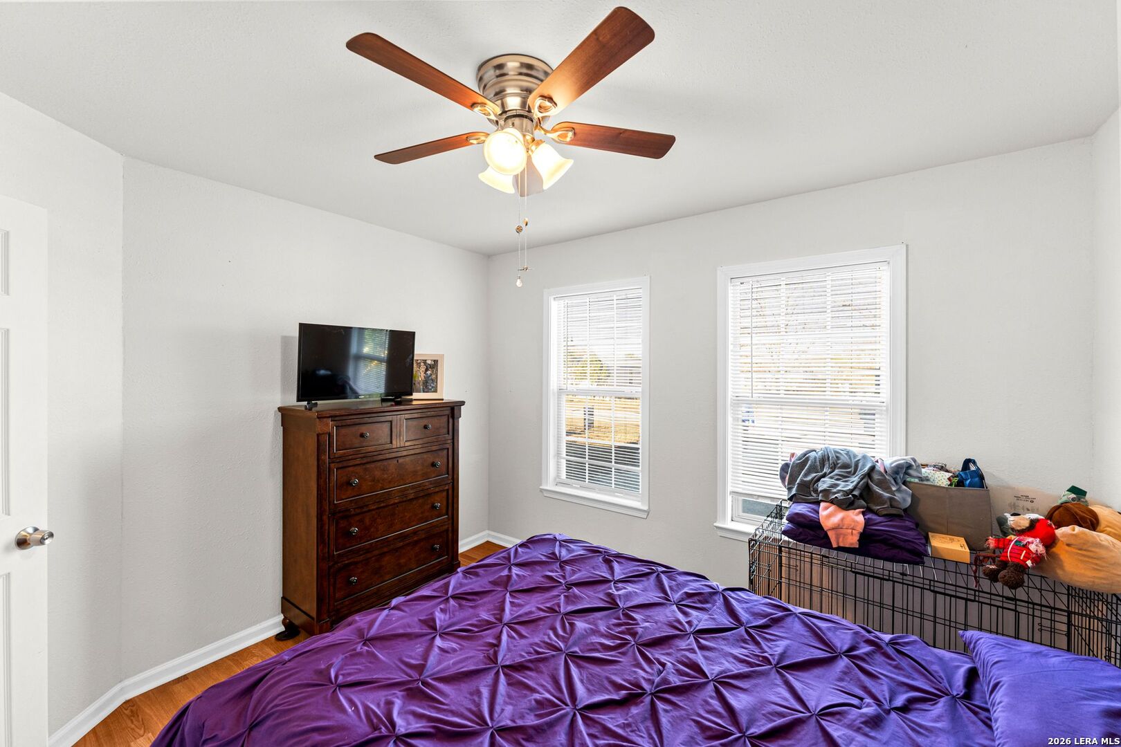 289 Chaparral Drive Bandera, TX 78003 - Photo 21 of 27 a bedroom with a bed and a flat screen tv