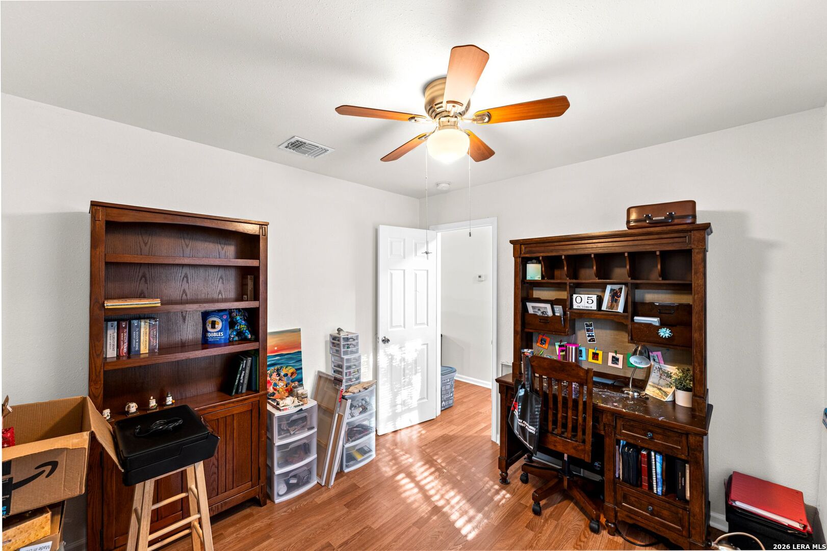 289 Chaparral Drive Bandera, TX 78003 - Photo 23 of 27 a view of a workspace with furniture and wooden floor