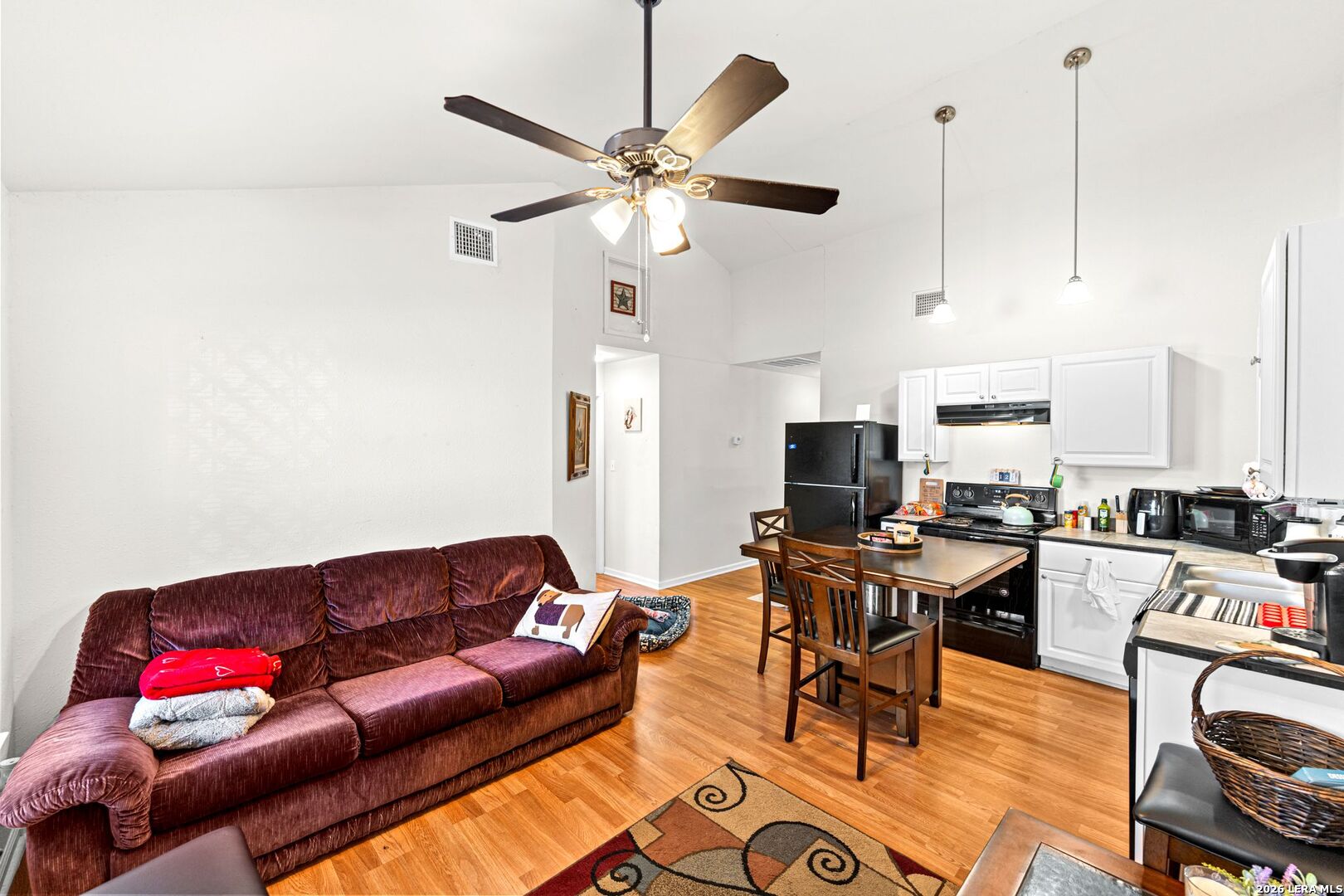 289 Chaparral Drive Bandera, TX 78003 - Photo 8 of 27 a living room with furniture kitchen view and a flat screen tv