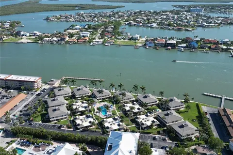 an aerial view of a houses with a table and chairs