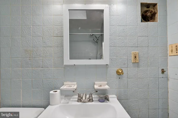 a bathroom with a toilet and a sink