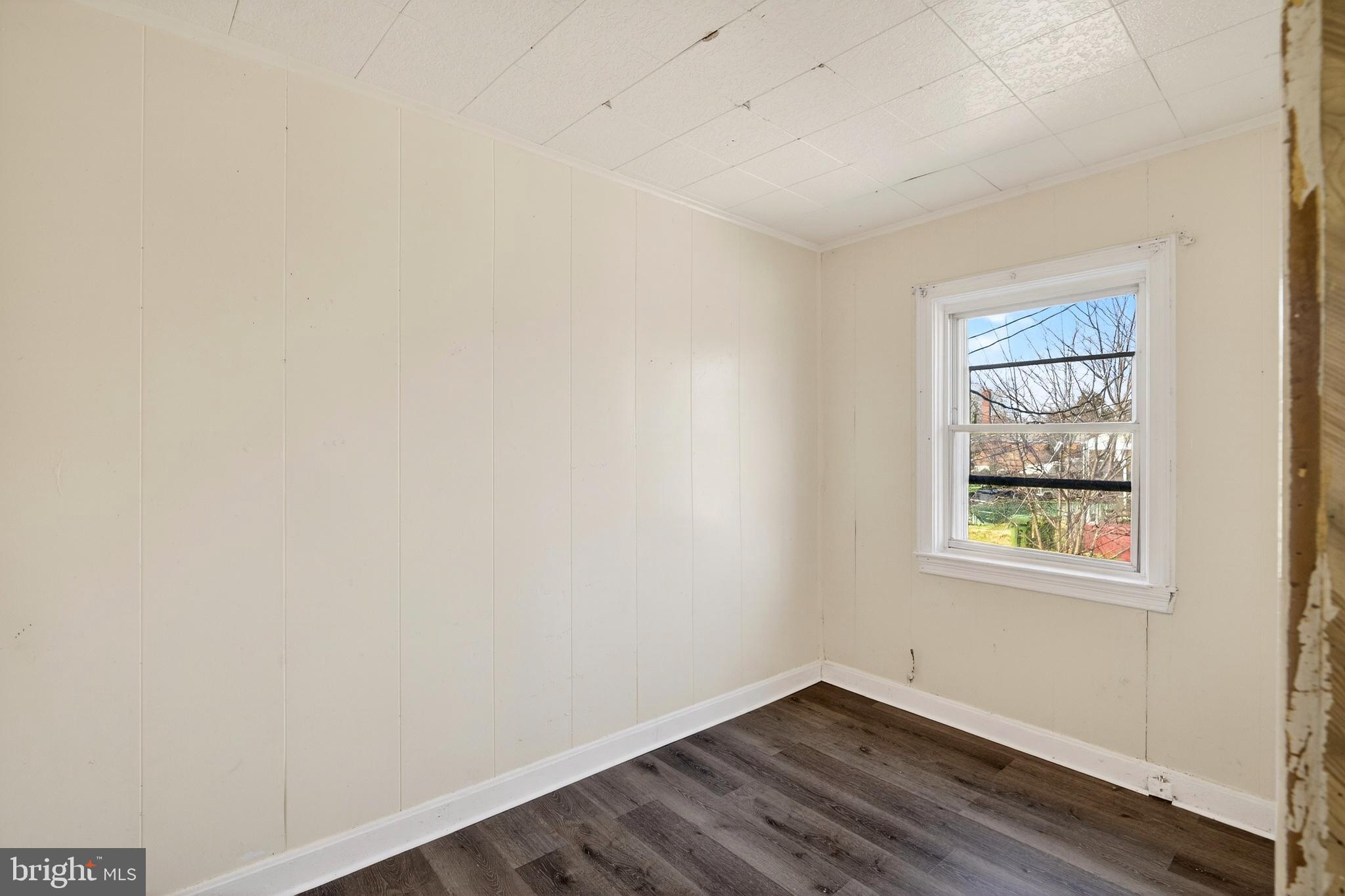 528 Sunset Road Baltimore, MD 21223 - Photo 14 of 27 an empty room with windows