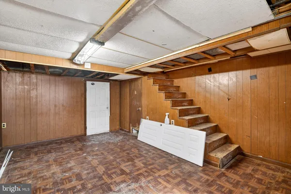 a view of an empty room with stairs