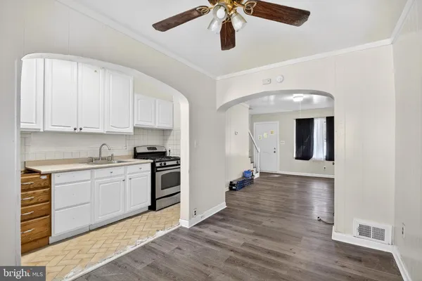 a kitchen with stainless steel appliances granite countertop a stove and a refrigerator