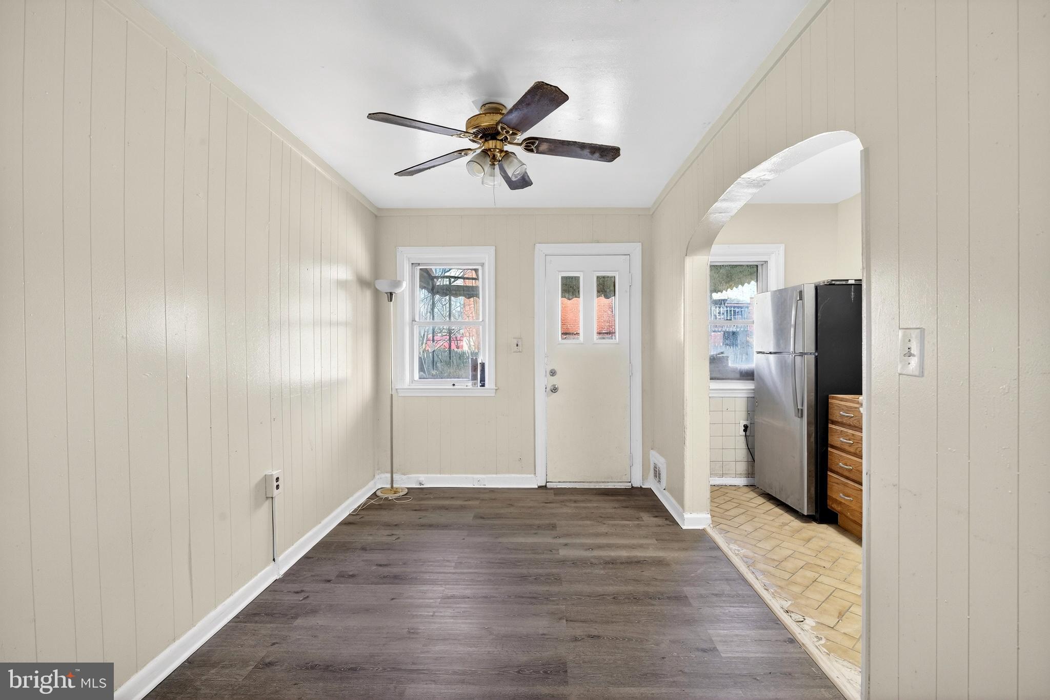 528 Sunset Road Baltimore, MD 21223 - Photo 7 of 27 a view of empty room with wooden floor and window