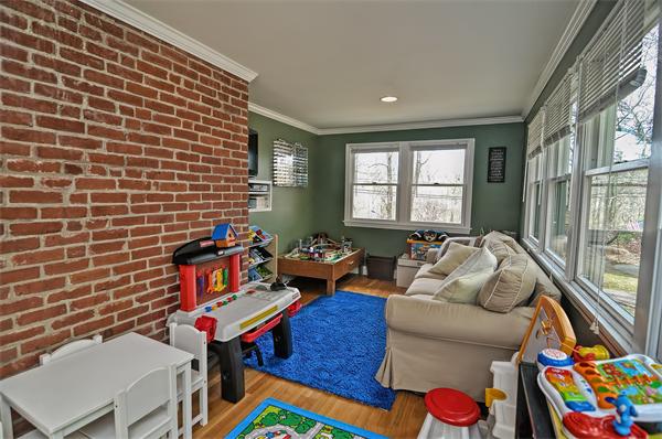 272 Main Street Norfolk, MA 02056 - Photo 12 of 29 a living room with furniture and a gate