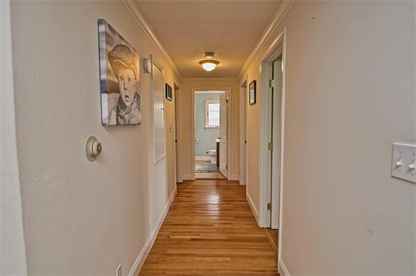272 Main Street Norfolk, MA 02056 - Photo 14 of 29 a view of a hallway with wooden floor and closet