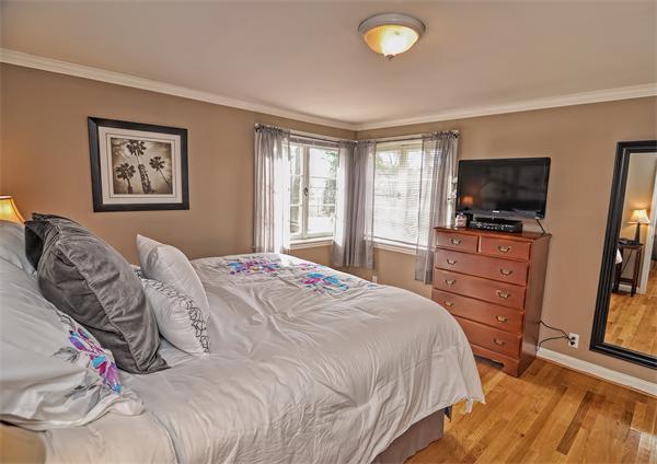 272 Main Street Norfolk, MA 02056 - Photo 17 of 29 a bedroom with a bed and a flat screen tv
