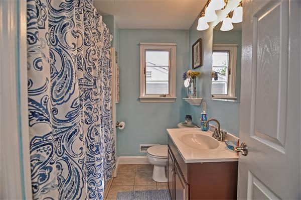 272 Main Street Norfolk, MA 02056 - Photo 18 of 29 a bathroom with a sink and a mirror