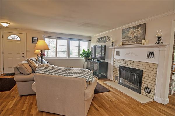 272 Main Street Norfolk, MA 02056 - Photo 7 of 29 a spacious bedroom with a bed and a fireplace