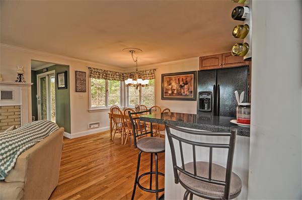 272 Main Street Norfolk, MA 02056 - Photo 9 of 29 a view of a dining room with furniture and wooden floor
