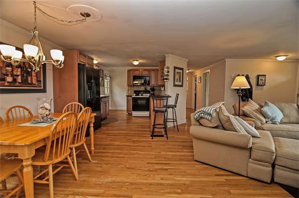 272 Main Street Norfolk, MA 02056 - Photo 10 of 29 a living room with furniture a dining table and chairs