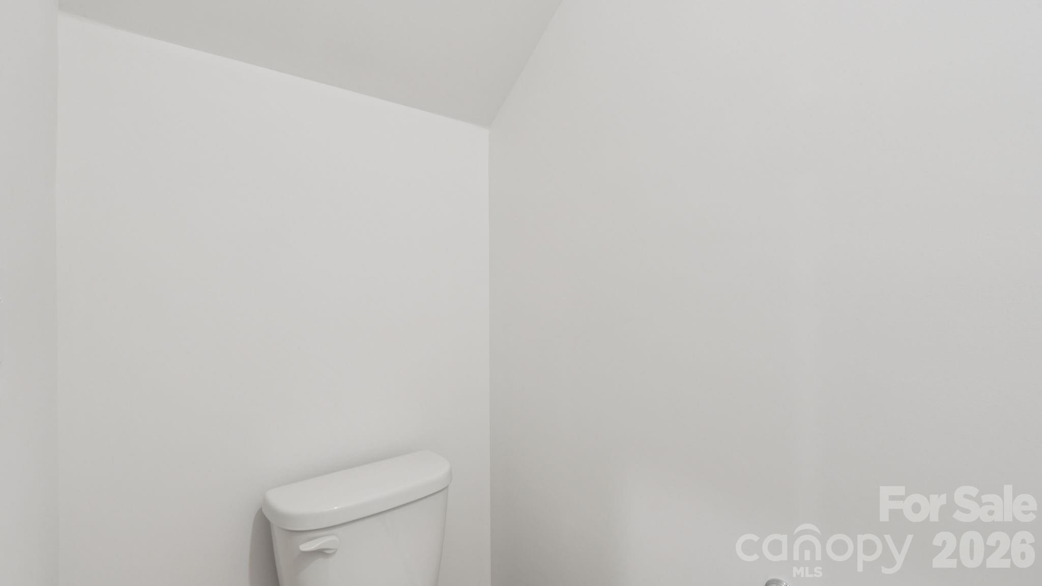1273 30th St Lane Northeast Conover, NC 28613 - Photo 9 of 21 a white toilet sitting next to a white wall