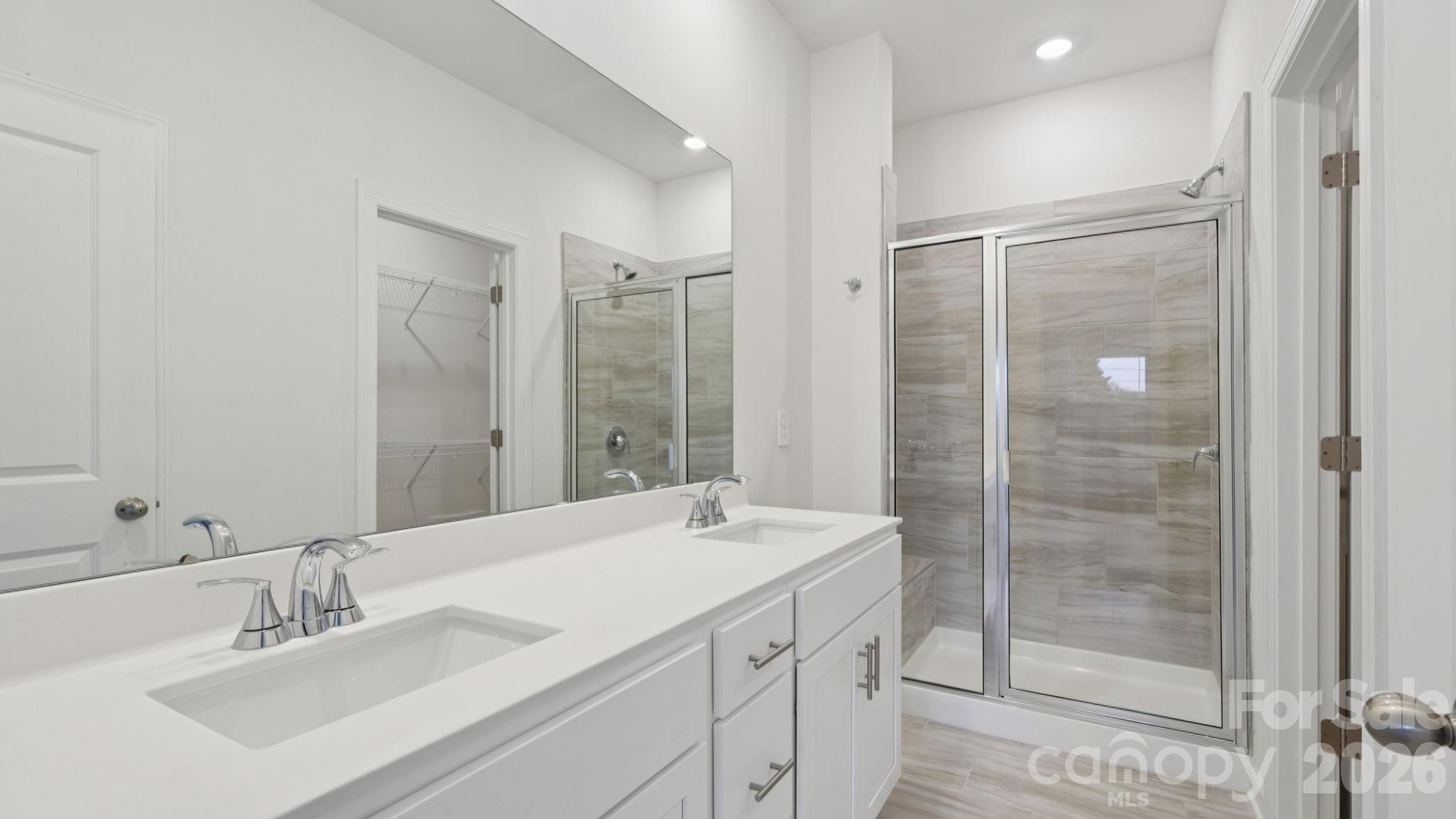 1273 30th St Lane Northeast Conover, NC 28613 - Photo 10 of 21 a bathroom with a shower sink vanity and mirror