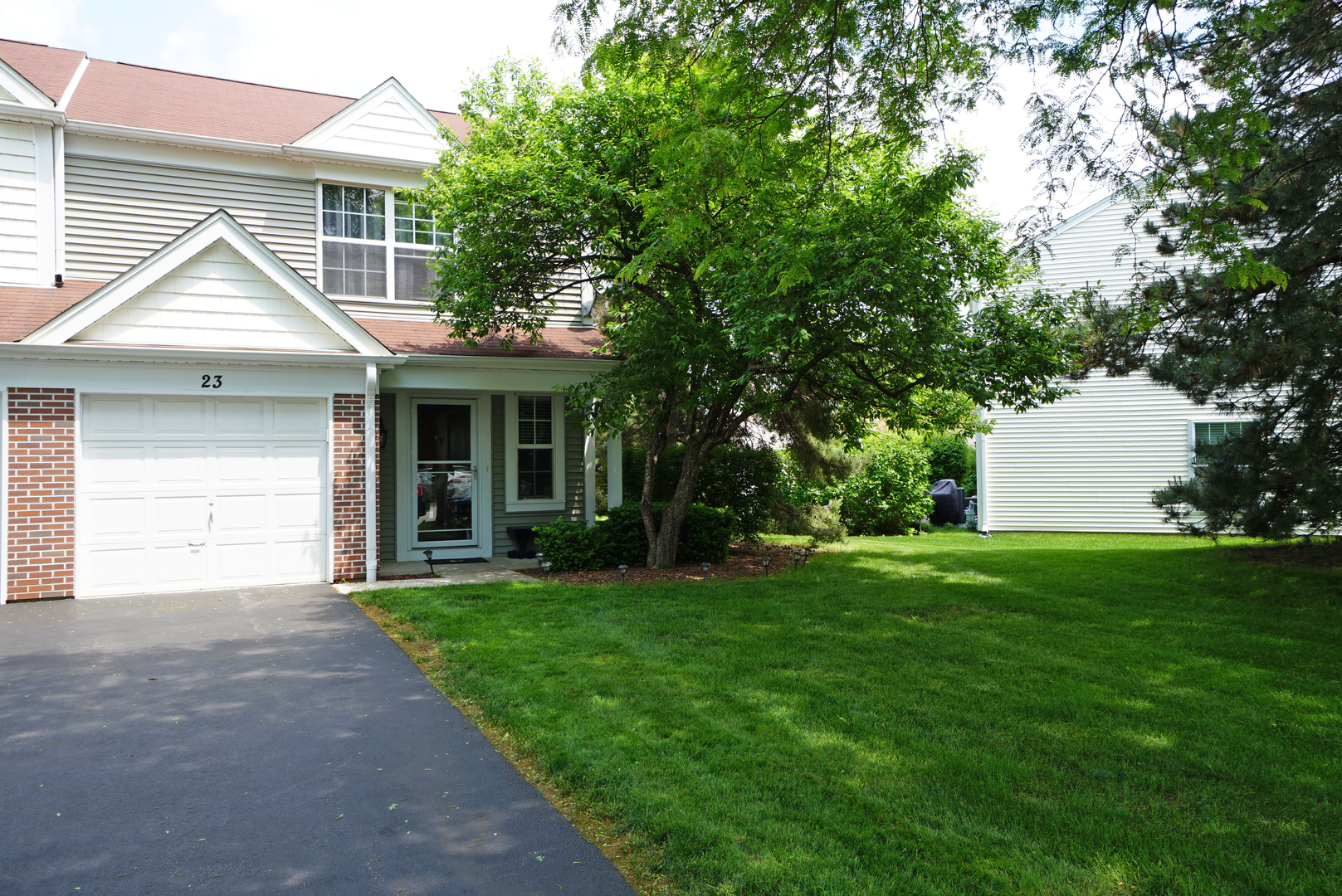 23 North Oltendorf Road Streamwood, IL 60107 - Photo 1 of 35 a front view of a house with a garden and yard