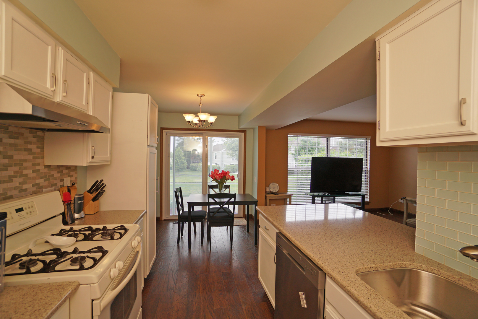 23 North Oltendorf Road Streamwood, IL 60107 - Photo 11 of 35 a kitchen with a stove a sink and a refrigerator