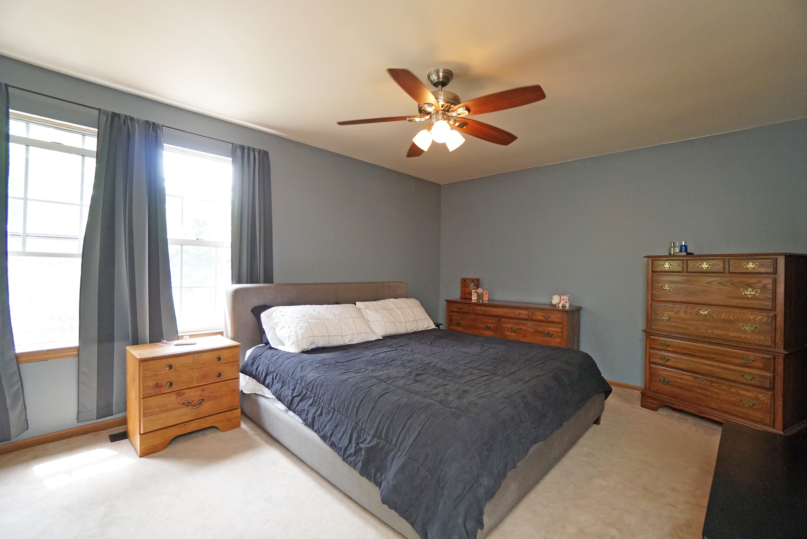 23 North Oltendorf Road Streamwood, IL 60107 - Photo 14 of 35 a bedroom with a bed and a chandelier