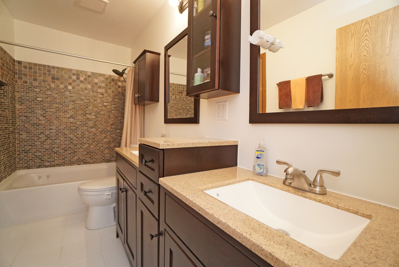 23 North Oltendorf Road Streamwood, IL 60107 - Photo 18 of 35 a bathroom with a granite countertop sink toilet and shower