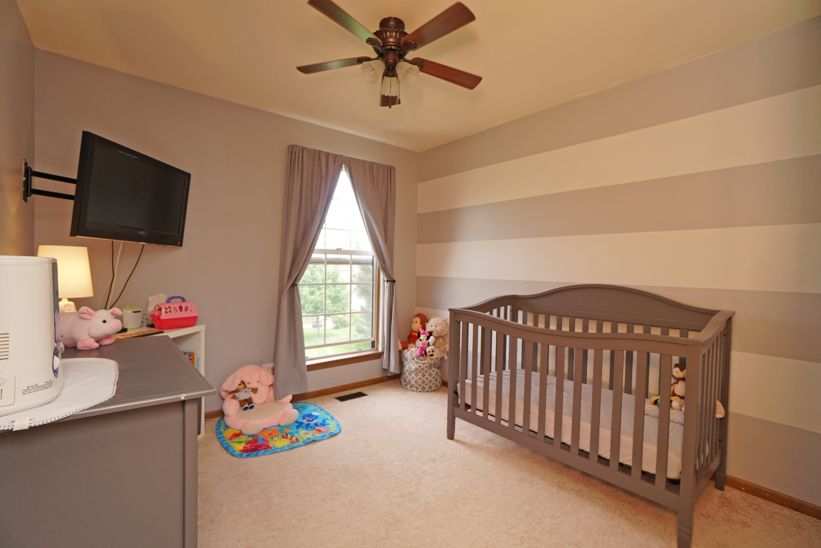 23 North Oltendorf Road Streamwood, IL 60107 - Photo 24 of 35 a bedroom with furniture a flat screen tv and a window