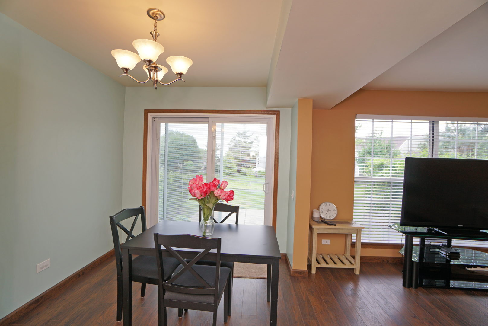 23 North Oltendorf Road Streamwood, IL 60107 - Photo 7 of 35 a view of a dining room with furniture window and wooden floor