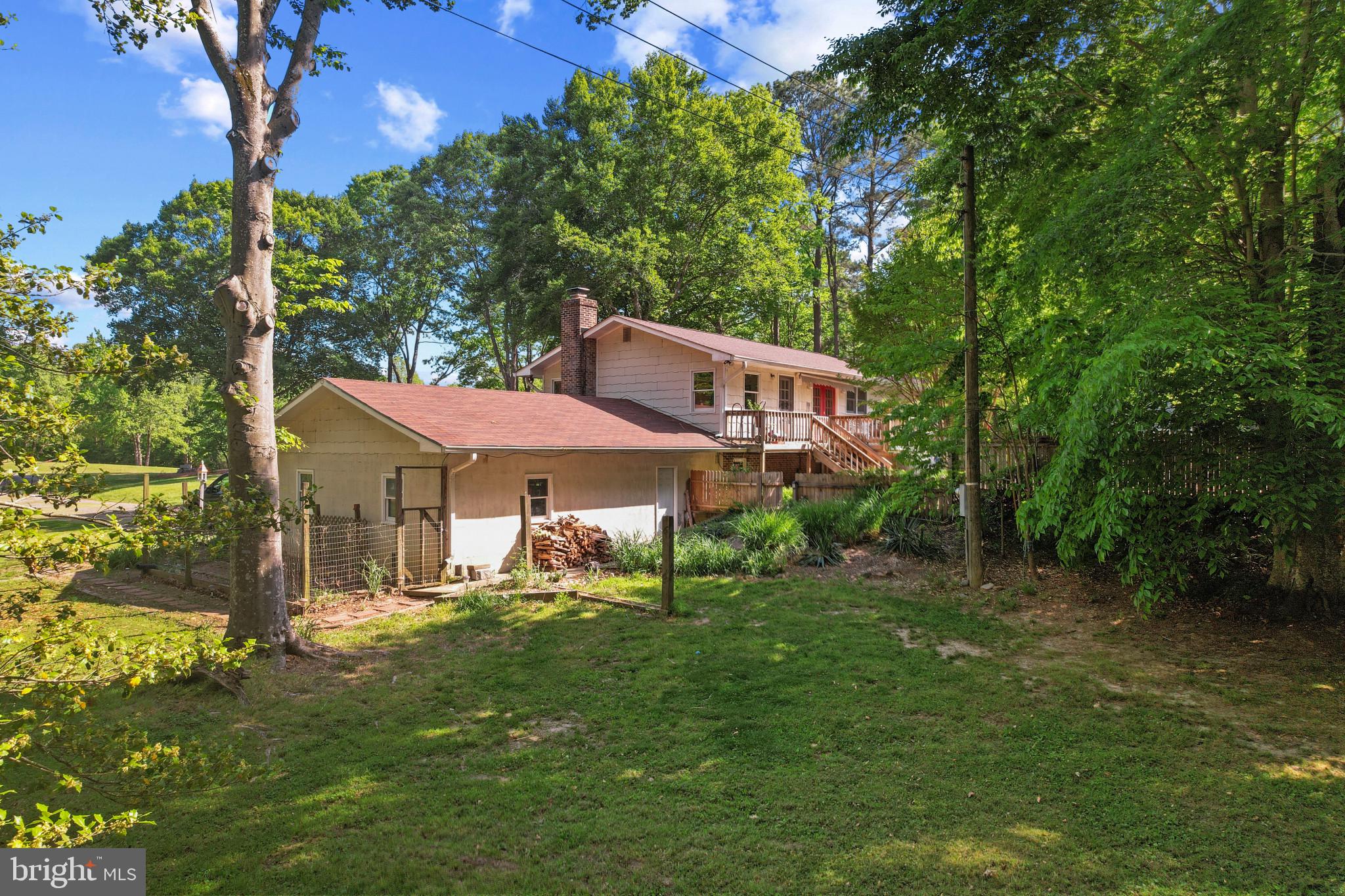 41 Wood Landing Road Fredericksburg, VA 22405 - Photo 28 of 54 a couple of table and chairs under an umbrella