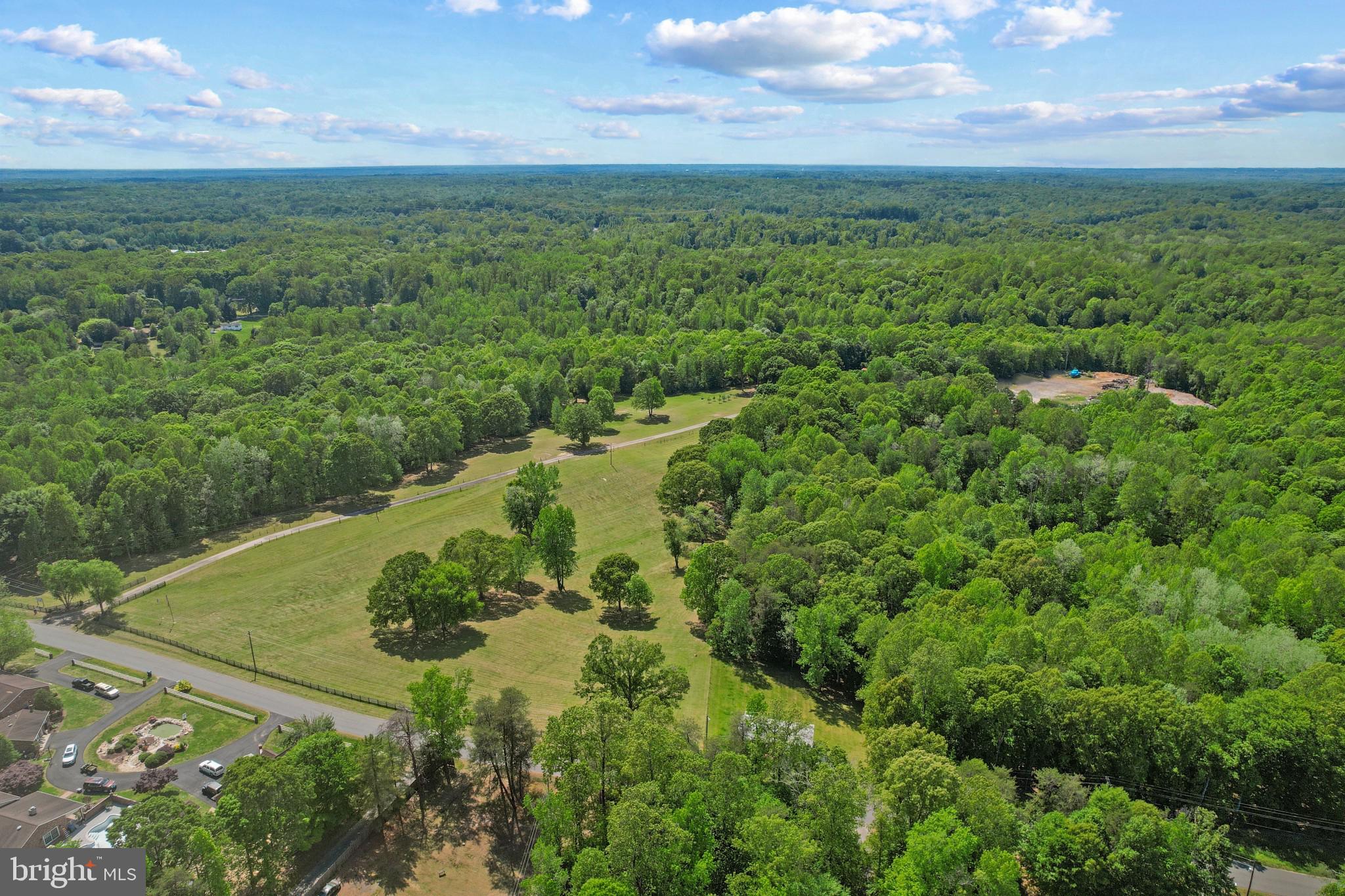 41 Wood Landing Road Fredericksburg, VA 22405 - Photo 29 of 54 a view of a lush green outdoor space with a lake view and mountain view