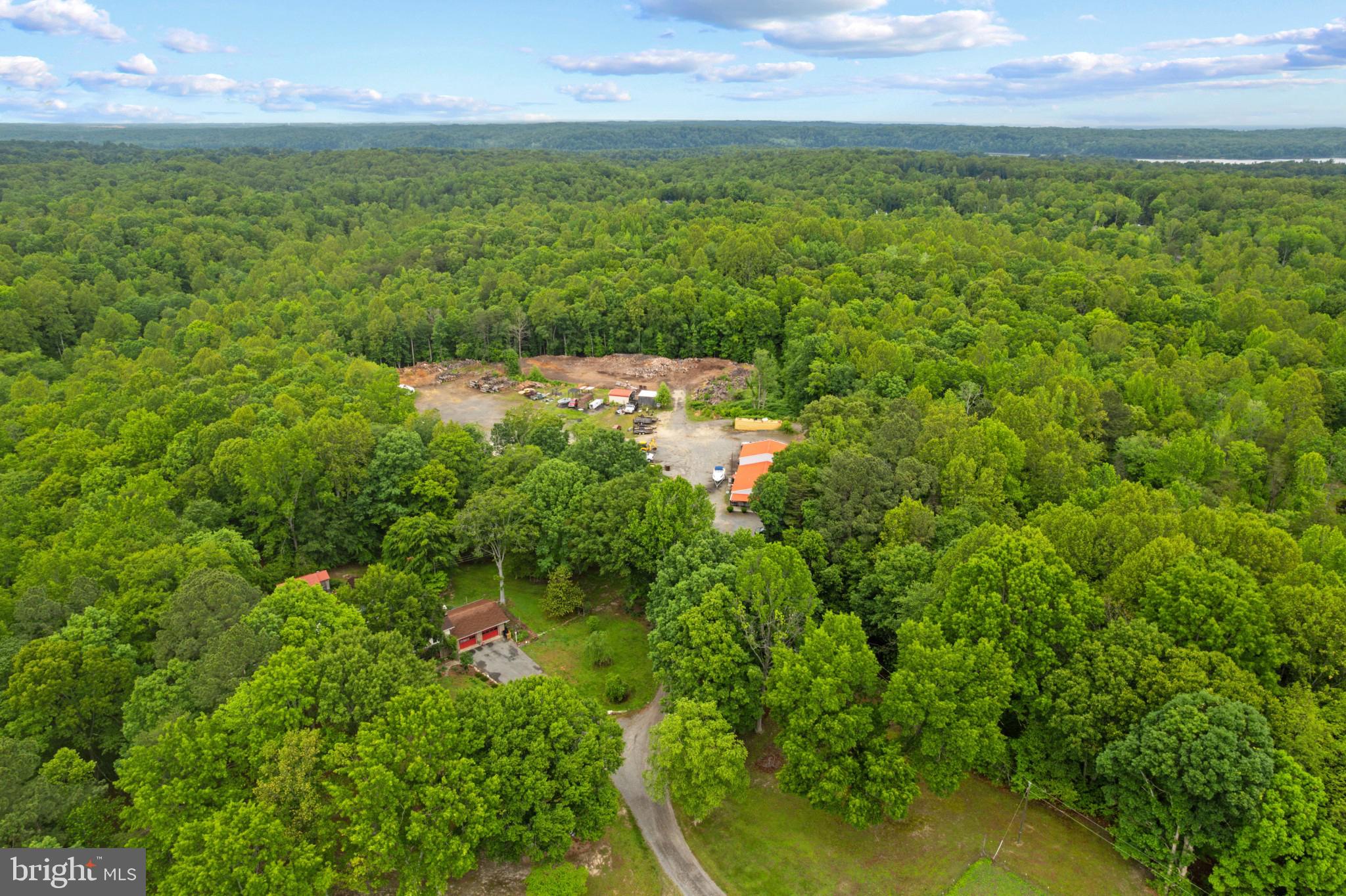 41 Wood Landing Road Fredericksburg, VA 22405 - Photo 36 of 54 a backyard of a house with lots of green space and mountain view in back