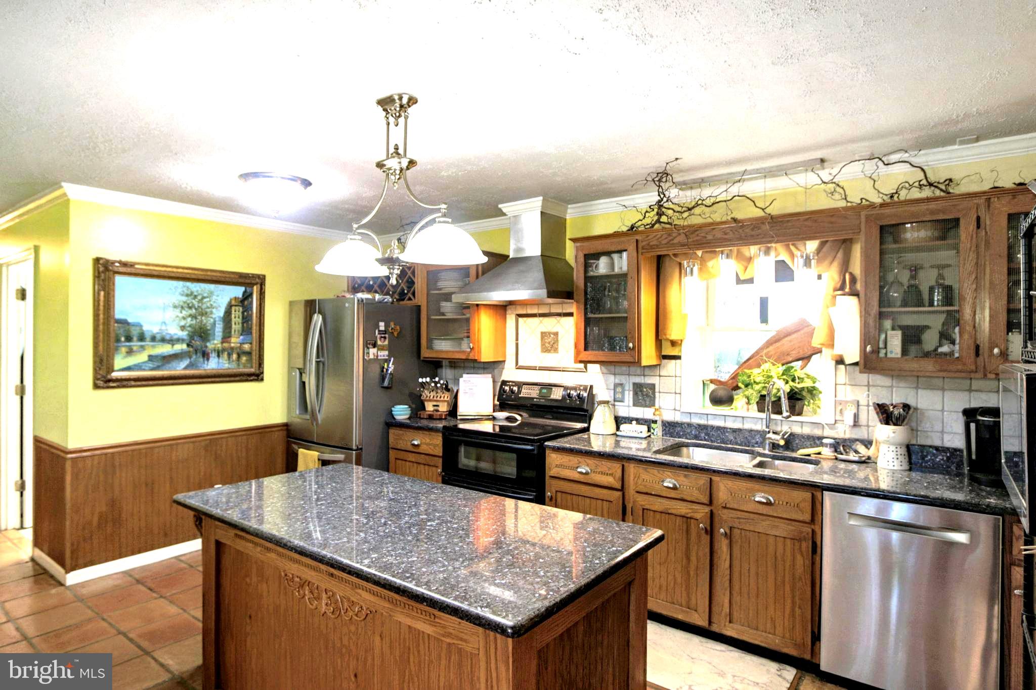 41 Wood Landing Road Fredericksburg, VA 22405 - Photo 4 of 54 a kitchen with a stove a sink a refrigerator dining table and chairs