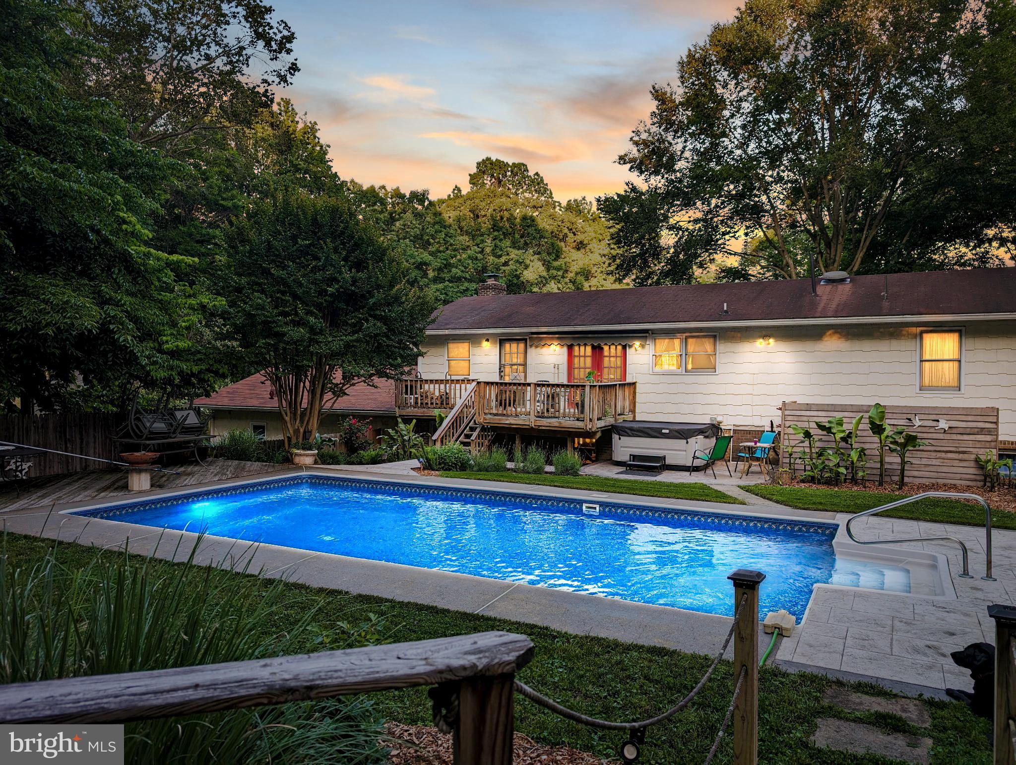 41 Wood Landing Road Fredericksburg, VA 22405 - Photo 10 of 54 a view of swimming pool with outdoor seating and trees in the background