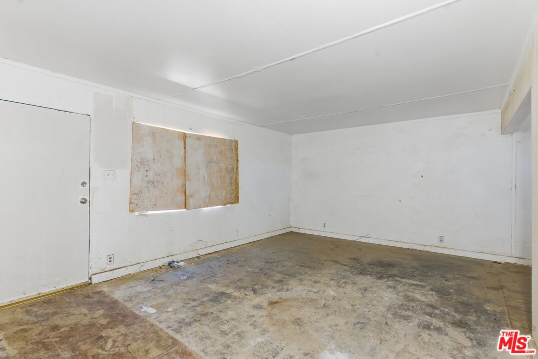 13879 Carson Street Trona, CA 93562 - Photo 11 of 29 a view of an empty room with a window