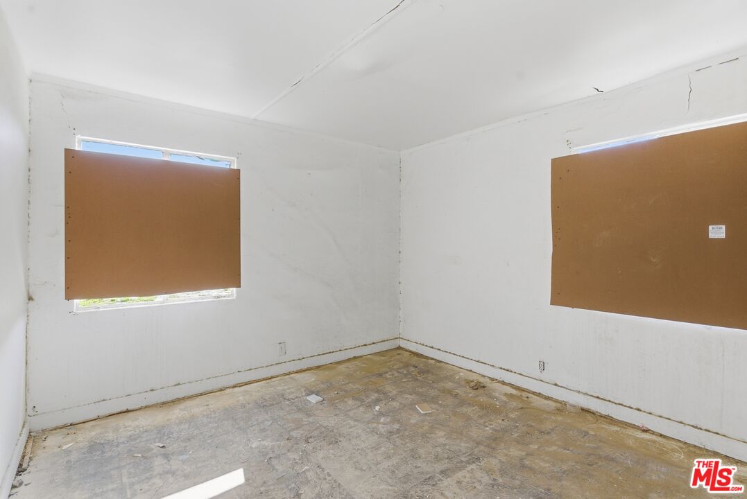 13879 Carson Street Trona, CA 93562 - Photo 16 of 29 an empty room with a window